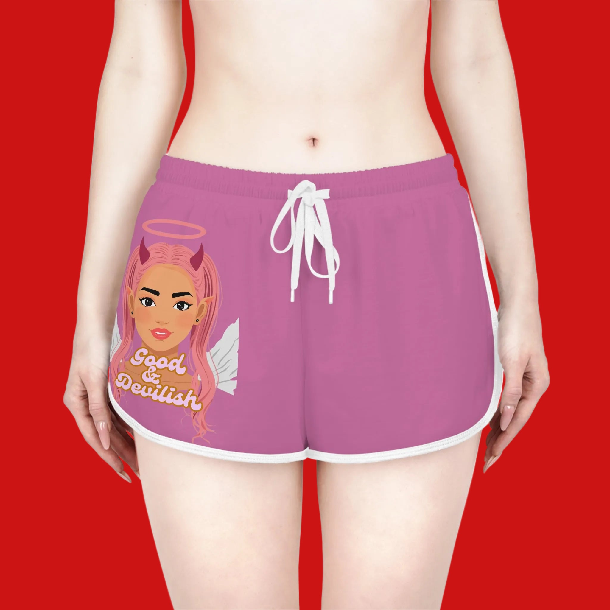 Purple shorts with a graphic design of a woman with pink hair and 'Good & Devilish' text on a red background.