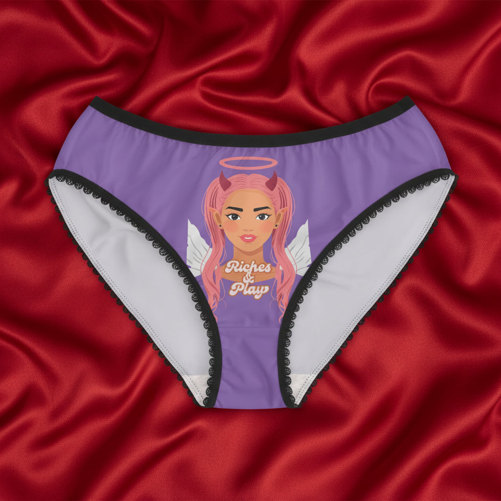 Purple Good & Devilish underwear on top of a silk comforter