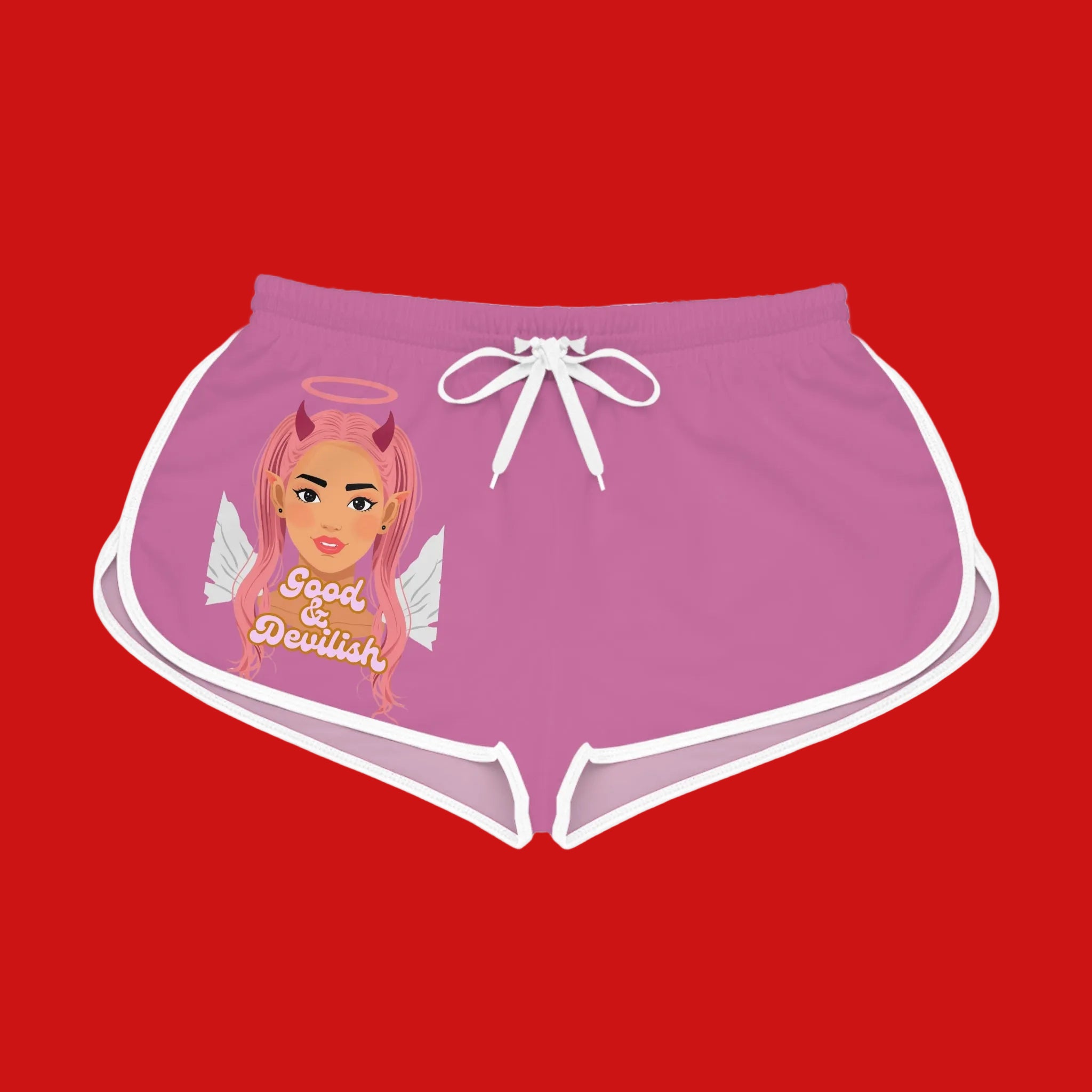 Pink shorts with a graphic design of a woman with pink hair, wings, and a halo on a red background.